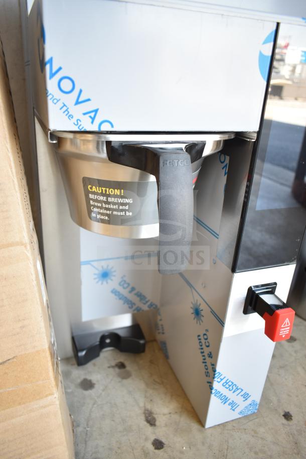 Brand new Fetco CBS-2232 commercial thermal coffee maker, scratch and dent. 208-240V, 1 phase. Caution label visible.