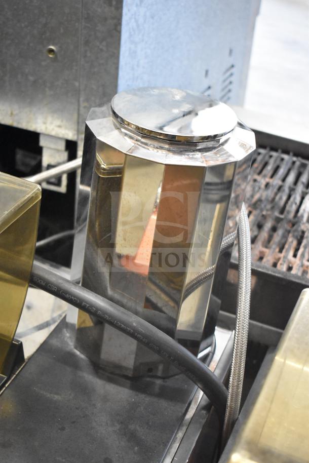 Stainless steel component from Thermoplan Mastrena M2-CS espresso machine, showing detailed construction and tubing.