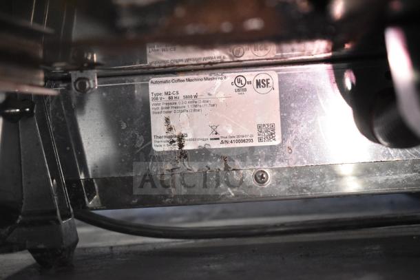 2019 Thermoplan Mastrena M2-CS espresso machine label showing model, voltage, and production date details.
