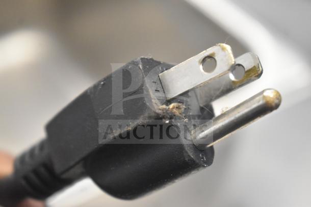Close-up of a slightly worn electrical plug belonging to an Avantco 177W50 Countertop Food Warmer. 120V, 1 Phase.