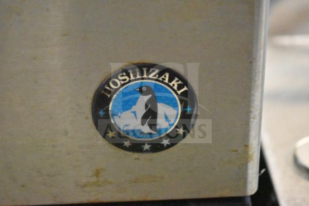 Hoshizaki KM-151BAH ice machine logo, shows penguin emblem on metal surface, emphasizing its brand identity.