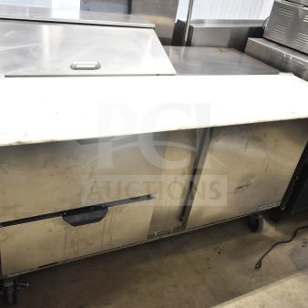 Beverage Air SPED60HC-08C-2 sandwich prep table with 1 door, 2 drawers, cutting top, and commercial casters. Used condition.