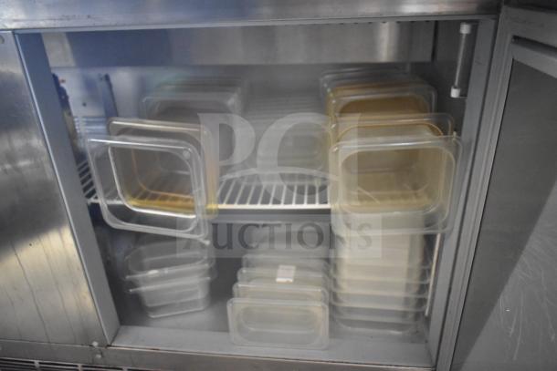Beverage Air SPED60HC-08C-2 prep table interior with food pans, commercial refrigeration unit, stainless steel finish.