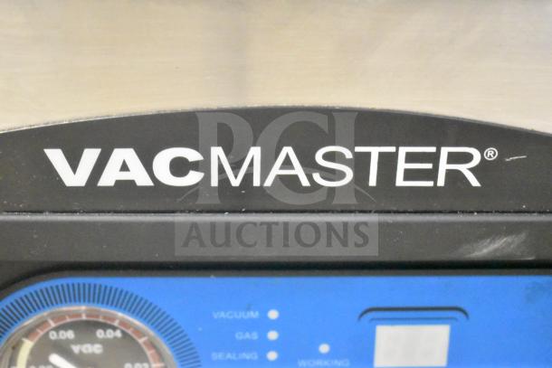 VacMaster VP-215 vacuum sealer panel close-up, showing brand logo and control indicators. Model in good condition.