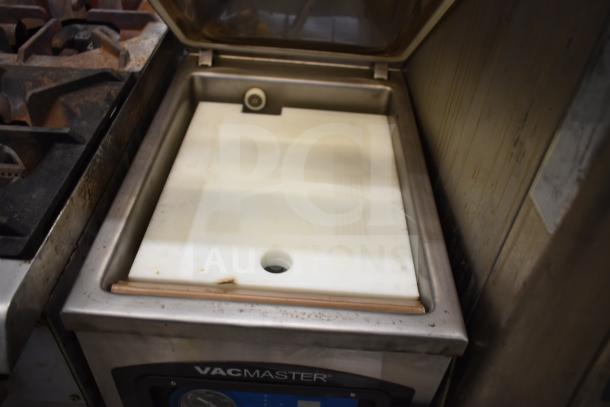 VacMaster VP-215 chamber vacuum sealer, commercial countertop model with 10" seal bar. Visible wear, 120 volts, 1 phase.