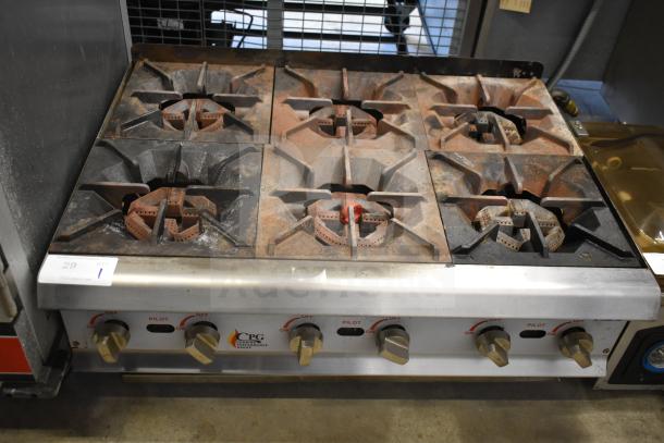 Cooking Performance Group 6 burner countertop gas range, used condition, with control knobs and visible wear. Model: CPG.