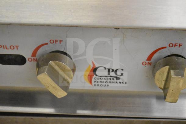 Cooking Performance Group gas range control panel with on/off knobs and logo visible, showcasing commercial quality.
