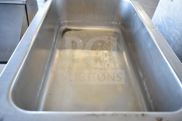Avantco 7700 Commercial Food Warmer, stainless steel, 120V, 1 Phase, visible wear, ideal for countertop use.
