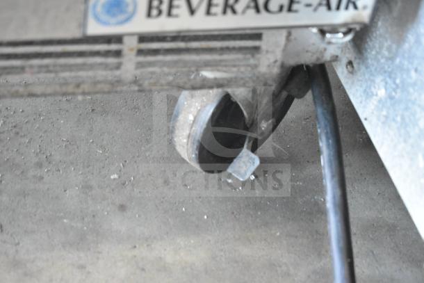 Beverage Air SPED60HC-08C-2 sandwich prep table, commercial caster shown, features a cutting top with 1 door and 2 drawers.