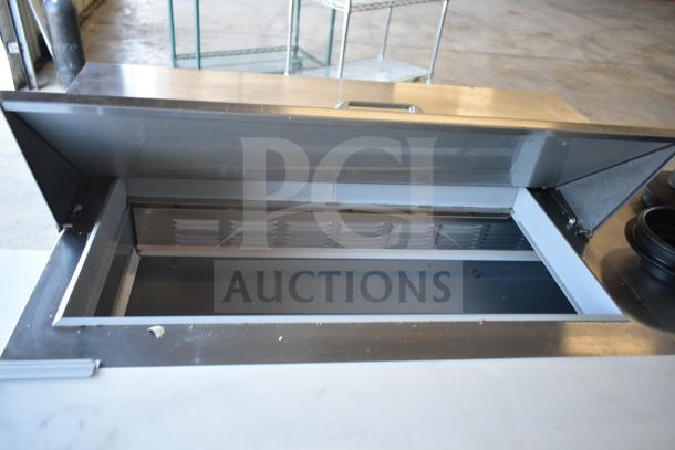 Beverage Air SPED60HC-08C-2 60" refrigerated sandwich prep table with cutting top, 1 door, 2 drawers, commercial casters.