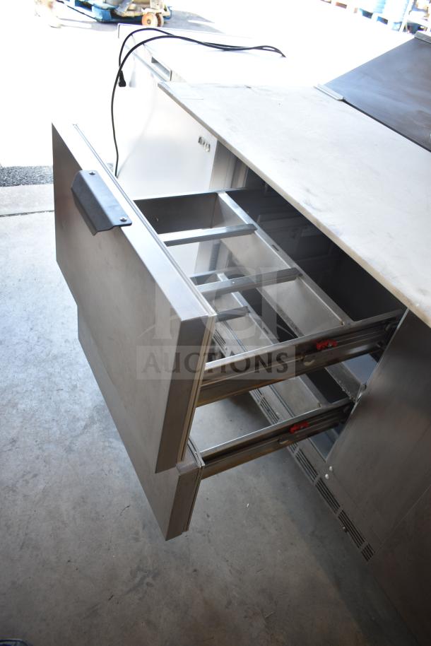 Beverage Air SPED60HC-08C-2 cutting top refrigerated sandwich prep table with one door, two drawers, on commercial casters.