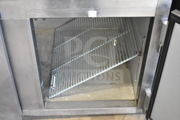 2016 Leader LM72 S/C Commercial Sandwich Salad Prep Table interior view, showing shelving and compartment condition.