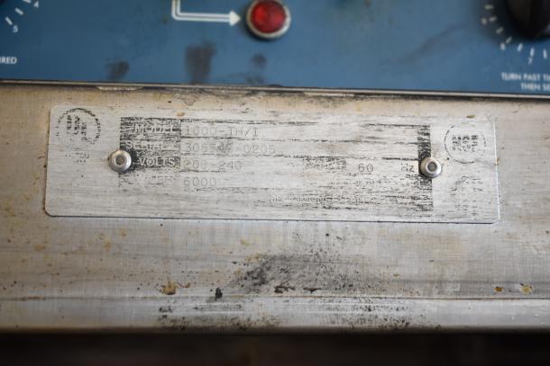 Alto Shaam 1000-TH/I oven nameplate, showing model, serial number, and voltage details.