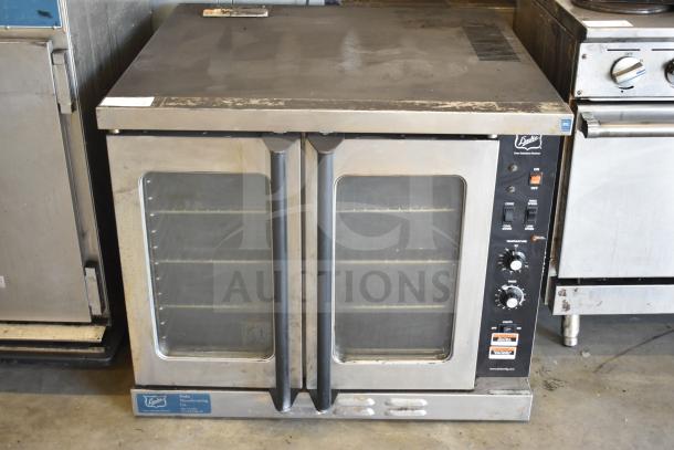 Duke stainless steel commercial convection oven, view-through doors, thermostatic controls, on metal legs. Used condition.