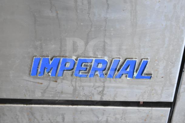 Imperial IR-6-E commercial electric range with 6 burners and oven. Features back splash, 208V, 3 phase power.