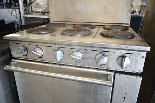 Imperial IR-6-E electric 6 burner range with oven and backsplash, 208V, 3 phase. Visible wear on knobs and burners.