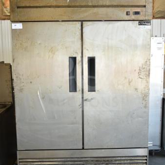 Dukers D55R Commercial 2 Door Reach In Cooler, stainless steel, 115 volts, 1 phase, visible wear, on wheels.