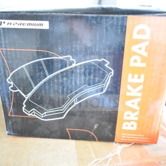 A-Premium Brake Pad box, new condition, visible scratch and dent. Includes brake pad, fuel injector, control arm kit.