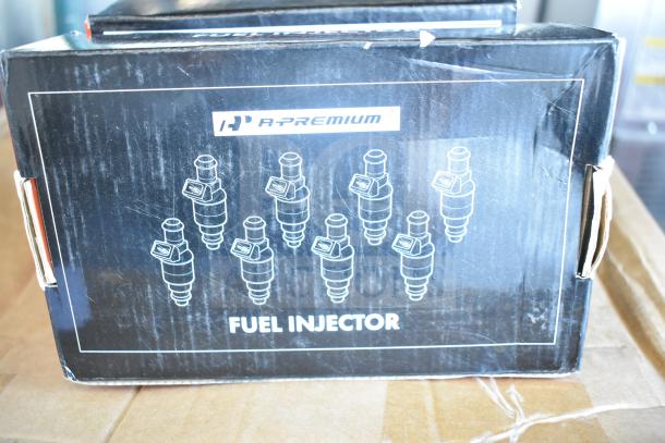 3 brand new A-Premium car parts including brake pad, fuel injector, and control arm kit. Scratch and dent. 3x bid value.