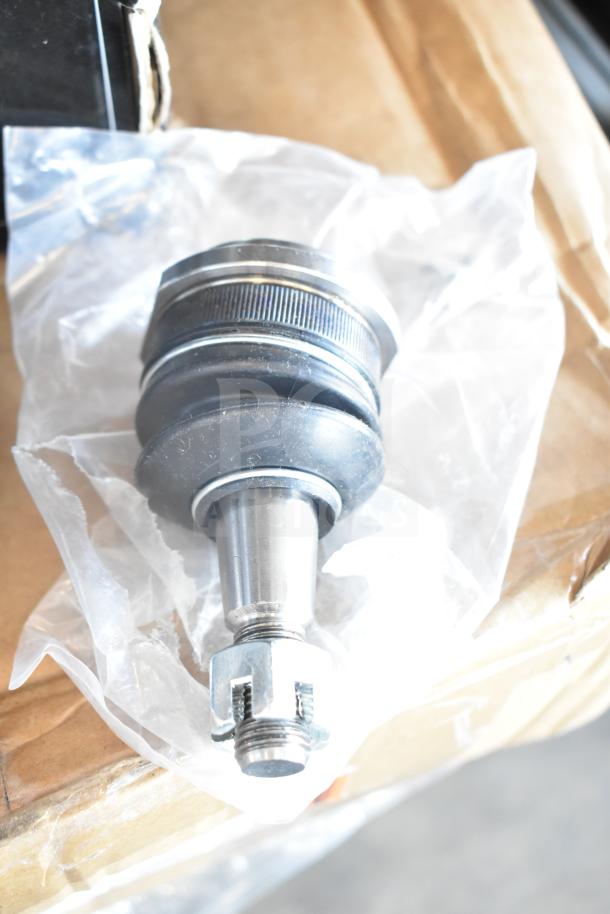 3 brand new automotive parts: brake pad, fuel injector, control arm kit, scratch and dent sale, wrapped and ready for auction.