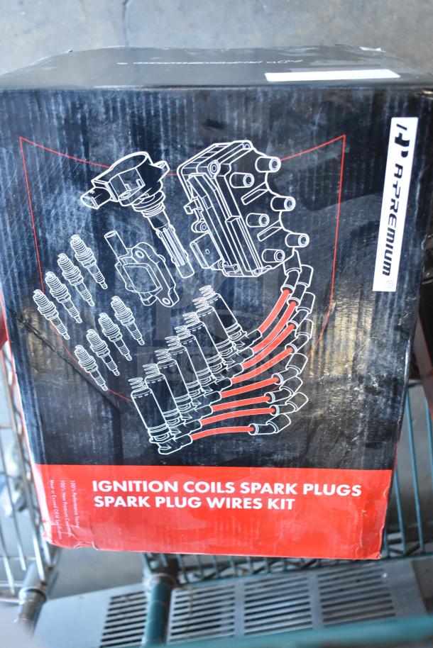 A-Premium ignition coils, spark plugs, and wire kit in branded box. New scratch and dent condition.