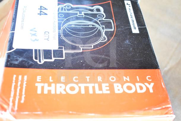 New electronic throttle body in box, labeled A-Premium. Contains auction tag indicating lot details.