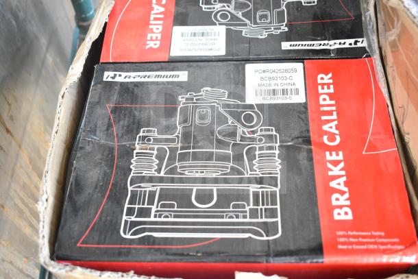 New A-Premium brake caliper boxes, model BCB93103-C, visible labels, slight packaging wear. Made in China.