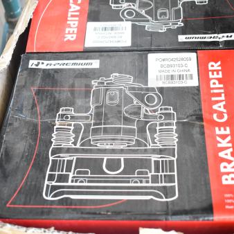New A-Premium brake caliper boxes, model BCB93103-C, visible labels, slight packaging wear. Made in China.