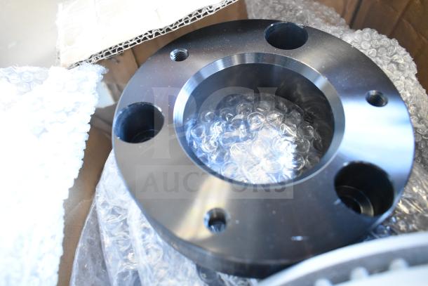 Brand new intake manifold with minor scratches, black finish, comes in bubble wrap packaging.