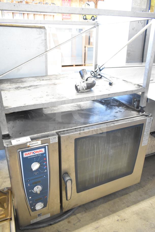 Rational CMP62 CombiMaster Plus convection oven with equipment stand, 208V, 3-phase, used condition. Control panel visible.