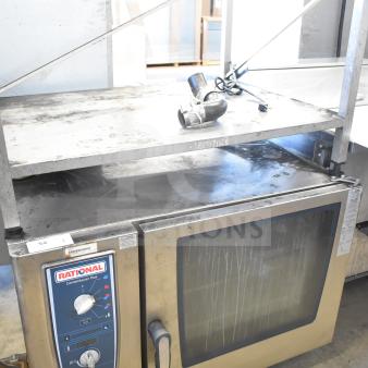 Rational CMP62 CombiMaster Plus convection oven with equipment stand, 208V, 3-phase, used condition. Control panel visible.