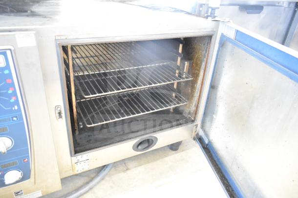 Rational CMP62 CombiMaster Plus convection oven with equipment stand. Visible racks and control panel. 208V, 3 Phase.