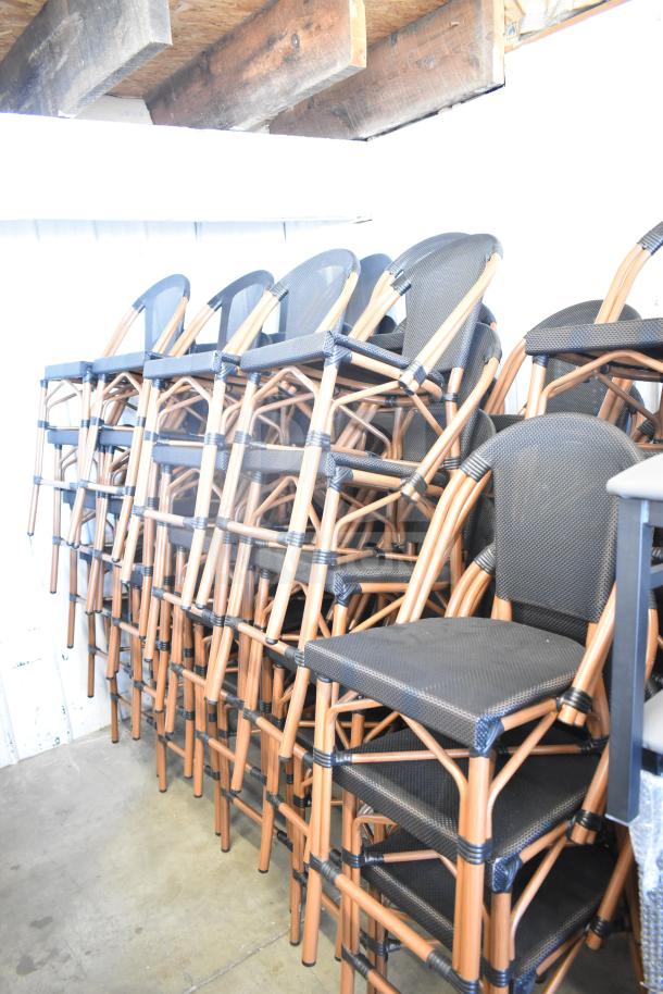 47 black mesh back and seat chairs with wooden frames, stackable design. Scratch and dent condition. Auction lot of 47.