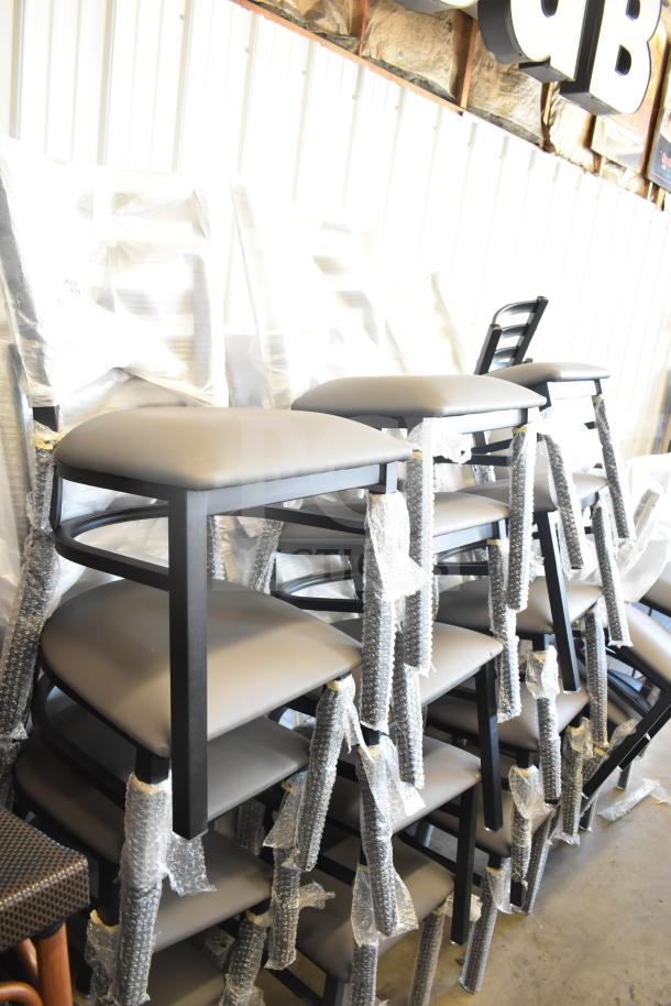 38 brand new ladder back dining chairs, tan/gray cushion, still in packaging, scratch and dent condition.