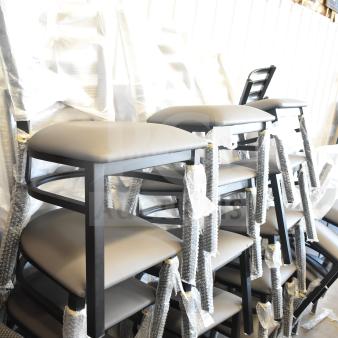 38 brand new ladder back dining chairs, tan/gray cushion, still in packaging, scratch and dent condition.