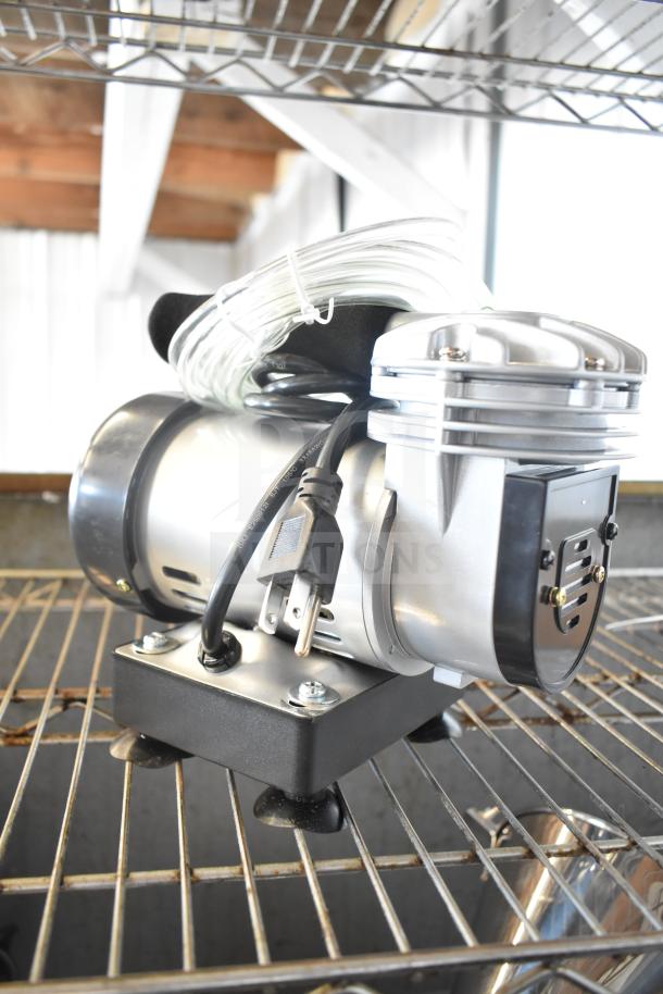 Bakery Crafts AB-C4 Motor, 110V, 1 Phase, in good condition, with attached power cord, placed on a metal rack.