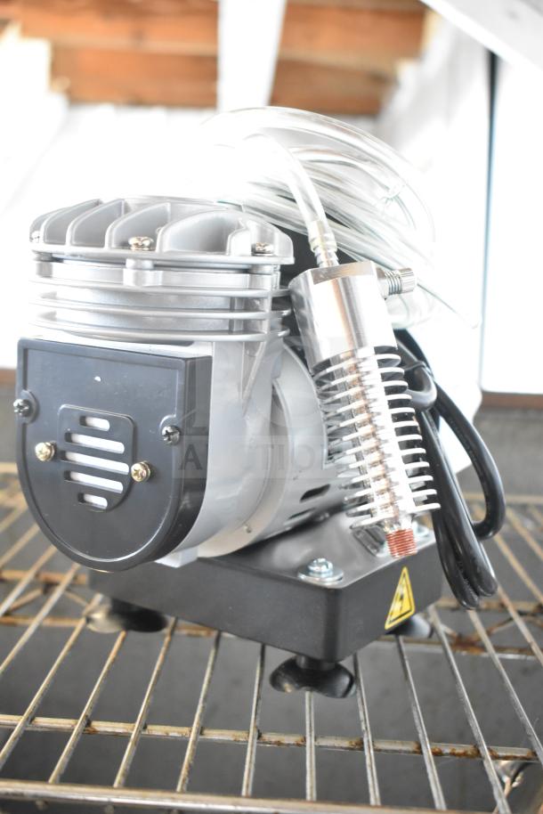 Bakery Crafts AB-C4 Motor, 110V, 1 Phase, new condition, shows cooling fins, coil, and power cord on a metal rack.