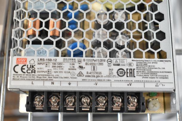 Mean Well LRS-150-12 12.5 Amp Enclosed Power Supply, detailed label showing input/output specifications and safety markings.