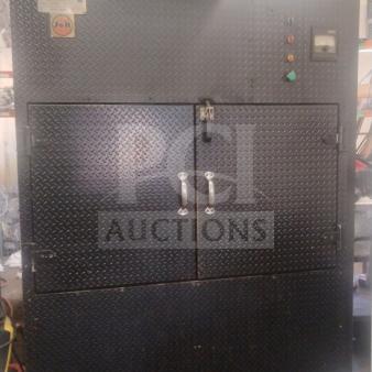 J&R Manufacturing Oyler 1300E smoker, black steel, diamond plate finish, dual doors, control panel visible, used condition.