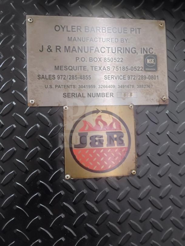 Metal plate on J&R Manufacturing Oyler 1300E smoker with serial number and contact details. Diamond plate background.