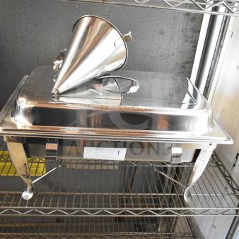 A new Choice chafer with a shiny stainless steel lid and dough dropper hopper, minor scratches visible, on a metal shelf.