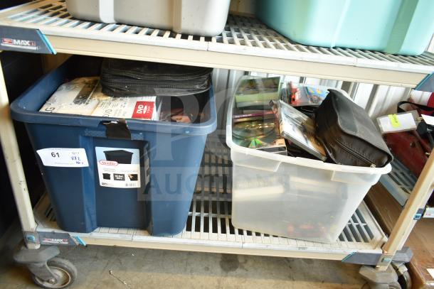 Two bins with various items, including an LG DVD player and assorted DVDs. Bins show light wear, labeled "Sterilite."