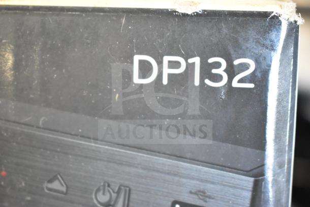 Close-up of LG DP132 DVD player box with visible model number. Box shows signs of wear.