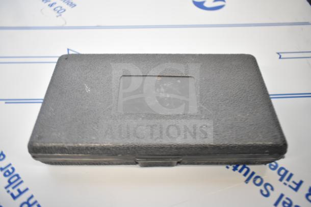 Sturdy black textured case with a rectangular indented area on top, suitable for storage or transport.