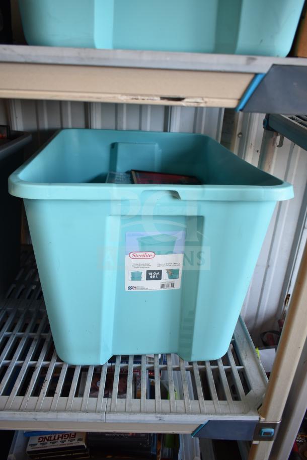Two Sterilite storage bins, 18-gallon capacity, containing various items including DVDs. Bins in good condition. Labels intact.