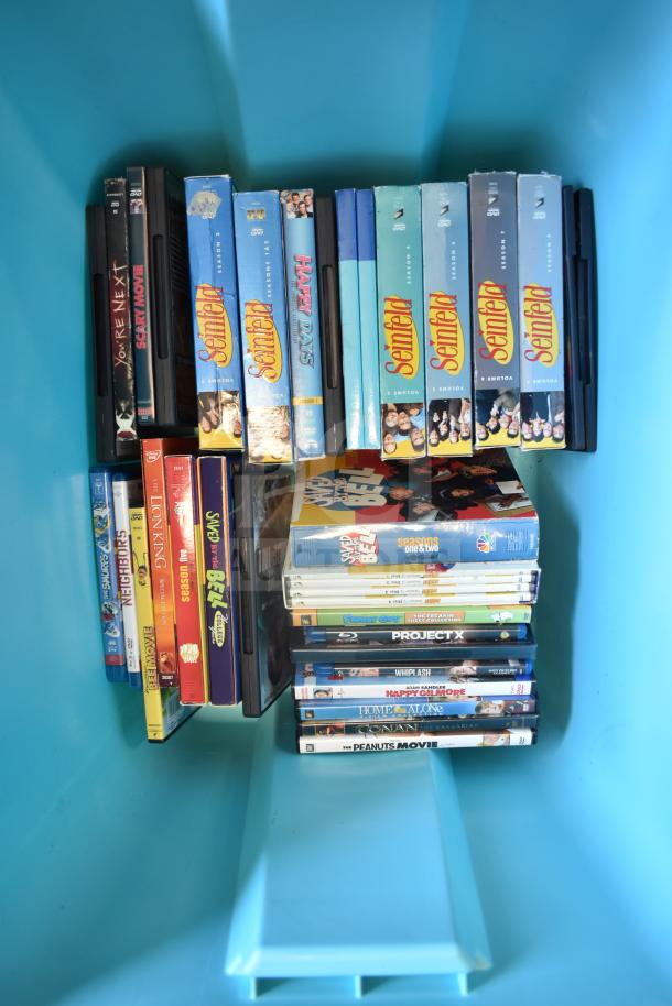 Blue bin filled with various DVD sets, including "Seinfeld," "Saved by the Bell," and "The Peanuts Movie," in good condition.