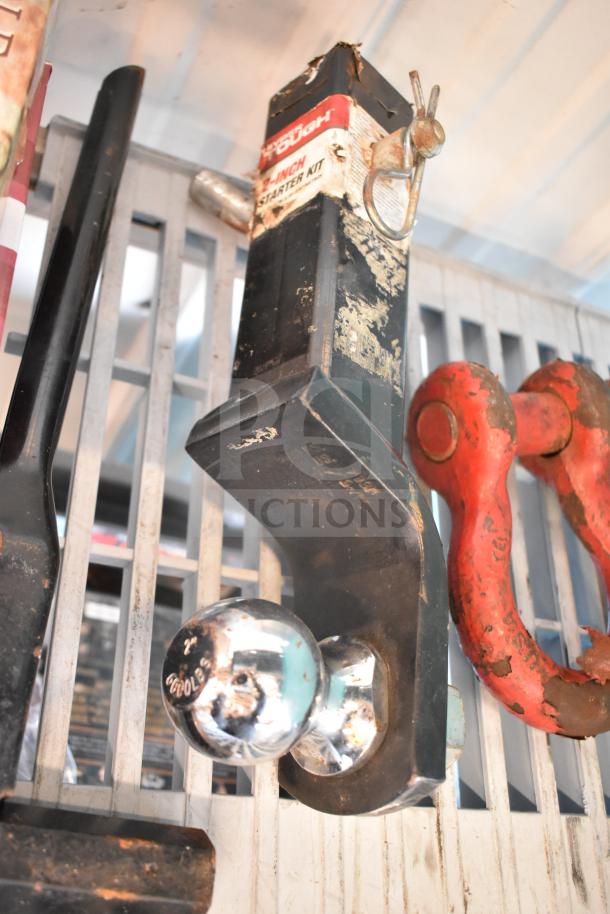 Lot of 12 items including a hitch with a 2-inch chrome ball and "Reese Towpower" label, showing signs of wear.