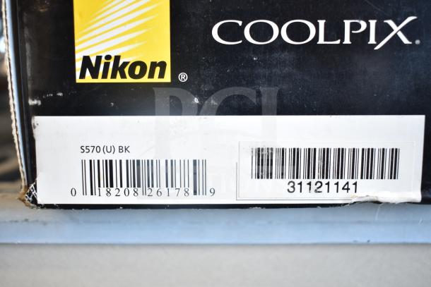 Nikon CoolPix S570 packaging with label showing barcode and model number. Includes A119 Dash Camera.