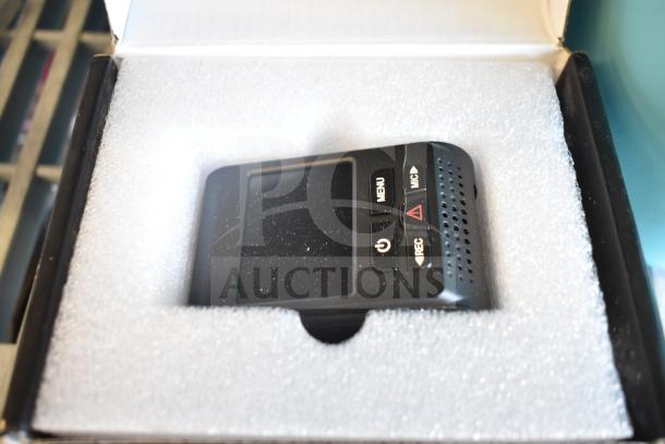 A119 Dash Camera in original packaging with protective foam, featuring menu, mic, and record buttons in pristine condition.