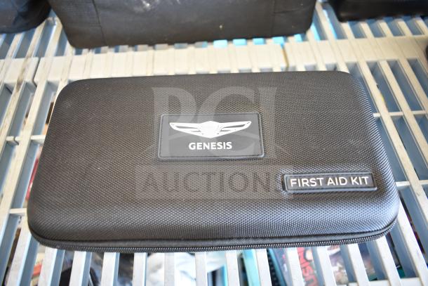 Genesis first aid kit in black zippered case, new condition, labeled with Genesis logo and "First Aid Kit".